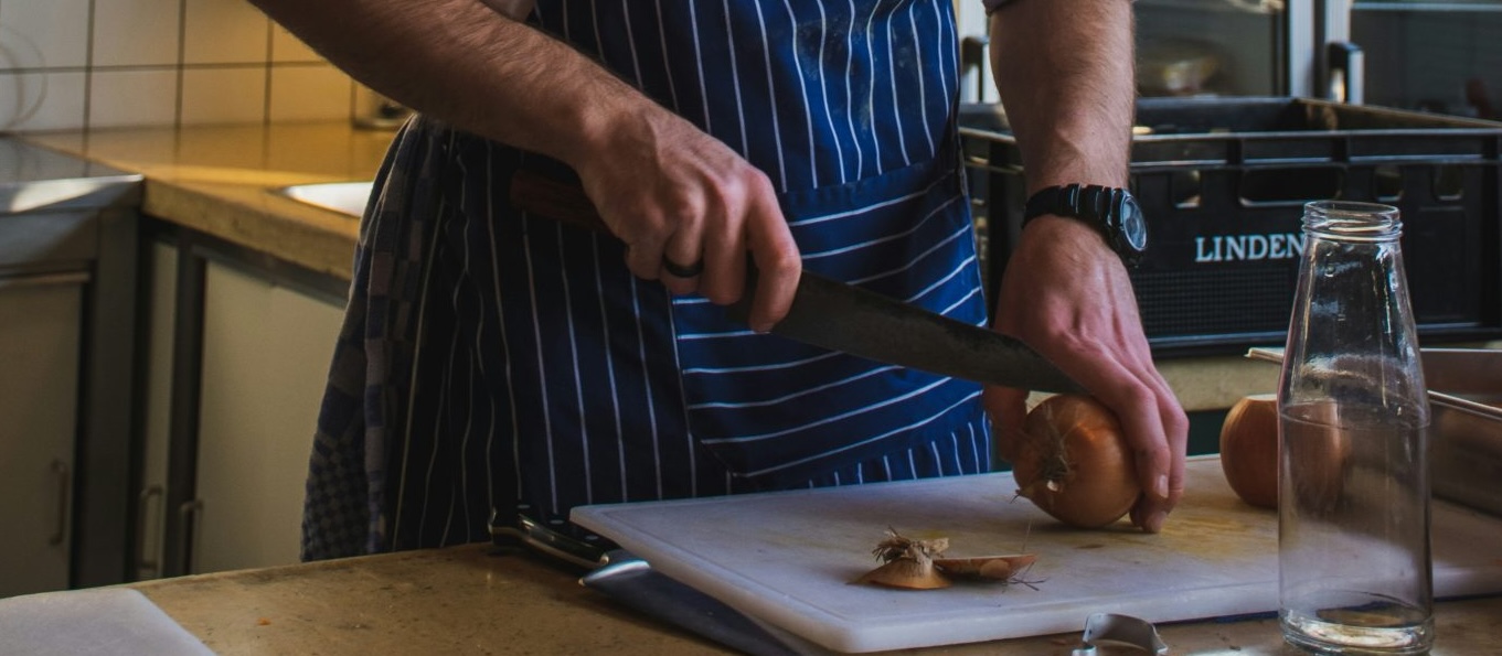 a chef chopping veg while catering for complex needs in care homes