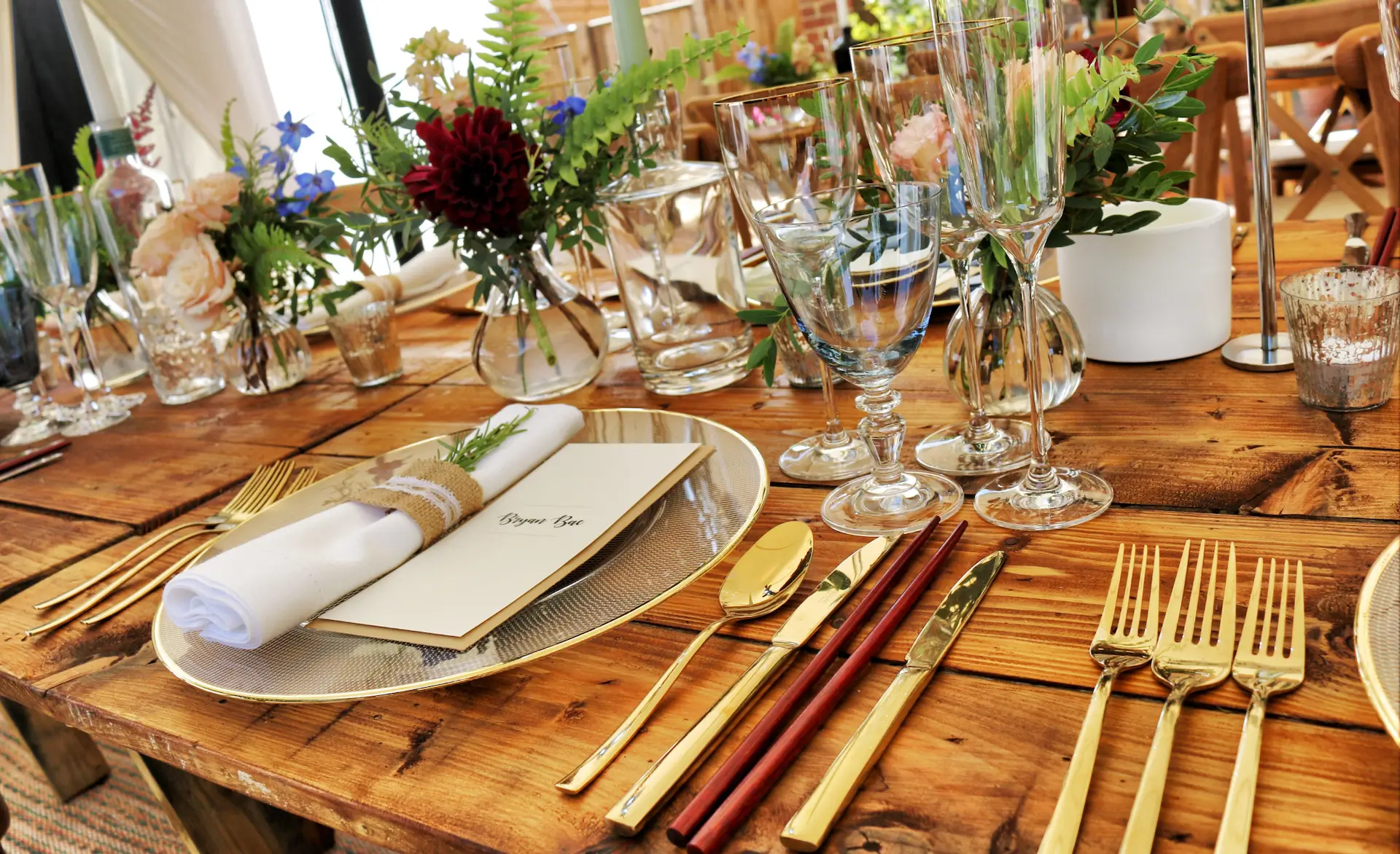 A fancy looking table laid out with fine dining ware.