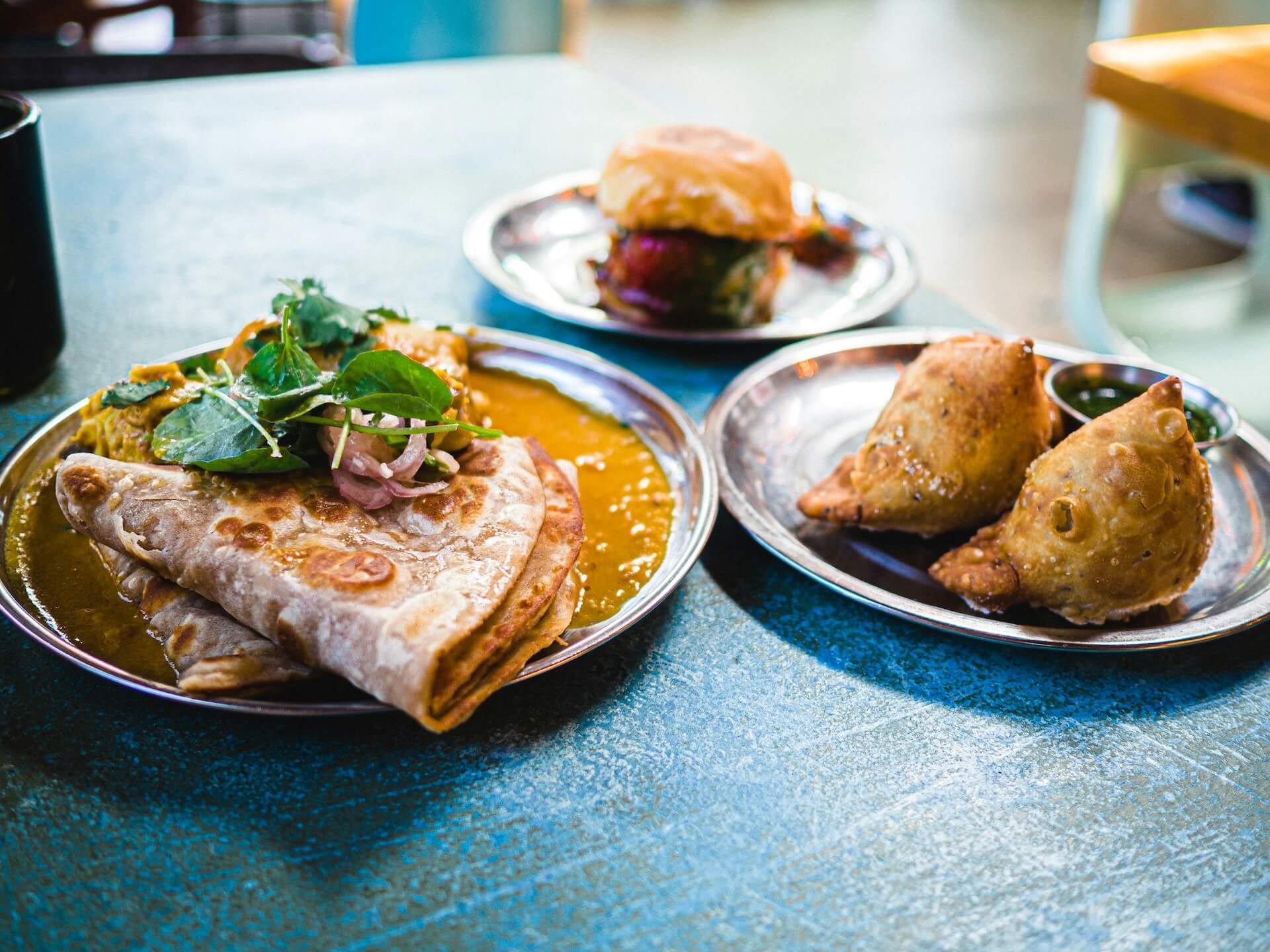 an image of multiple dishes of Indian cuisine