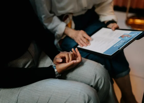 two people sat down reading over a CV