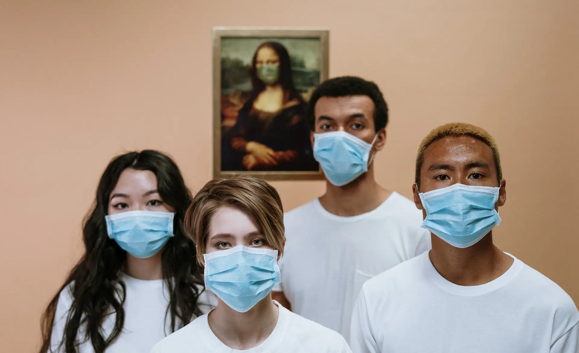 a group of individuals wearing PPE masks