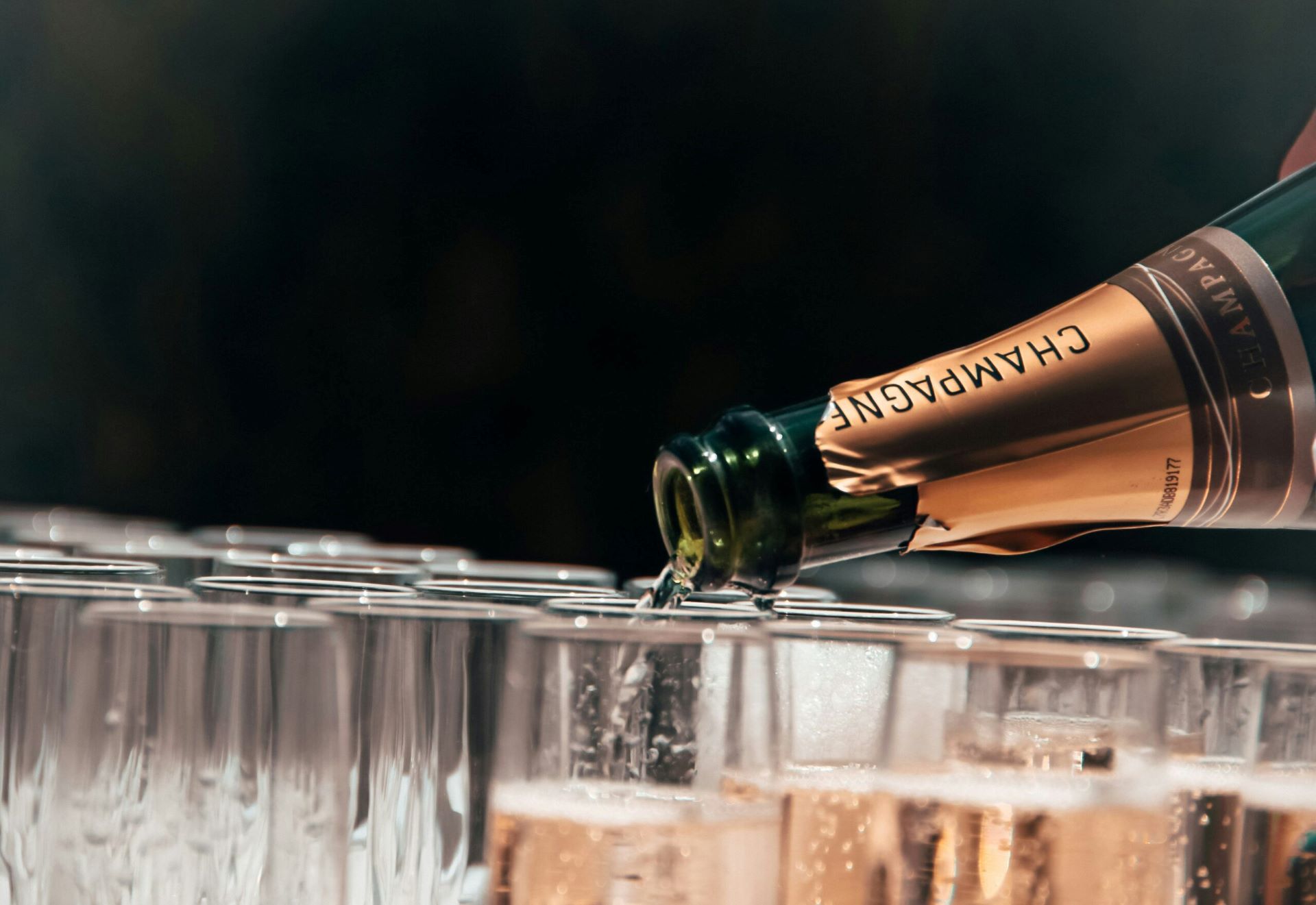 event catering staffing agency staff pouring champagne at an event